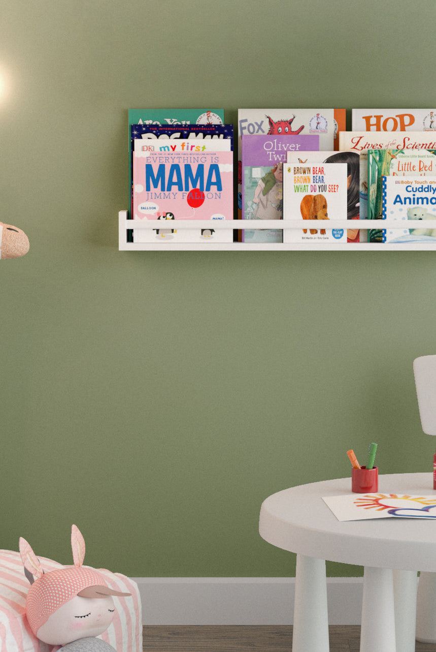 UTAH 32'' Kids Book Shelf in white, mounted in a child's bedroom with school books displayed cover-out
