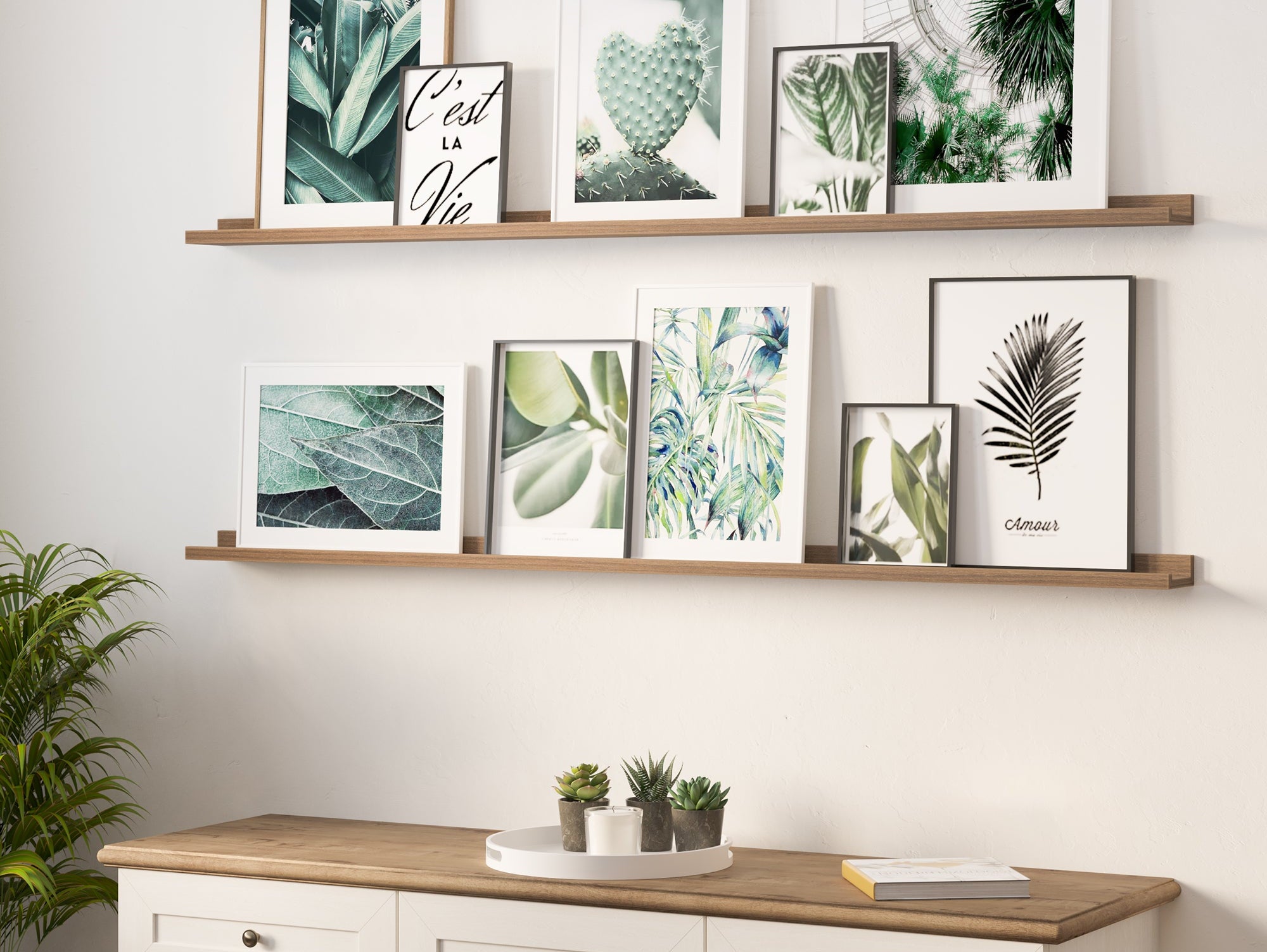 DENVER walnut picture ledge styled with layered art frames in a living room