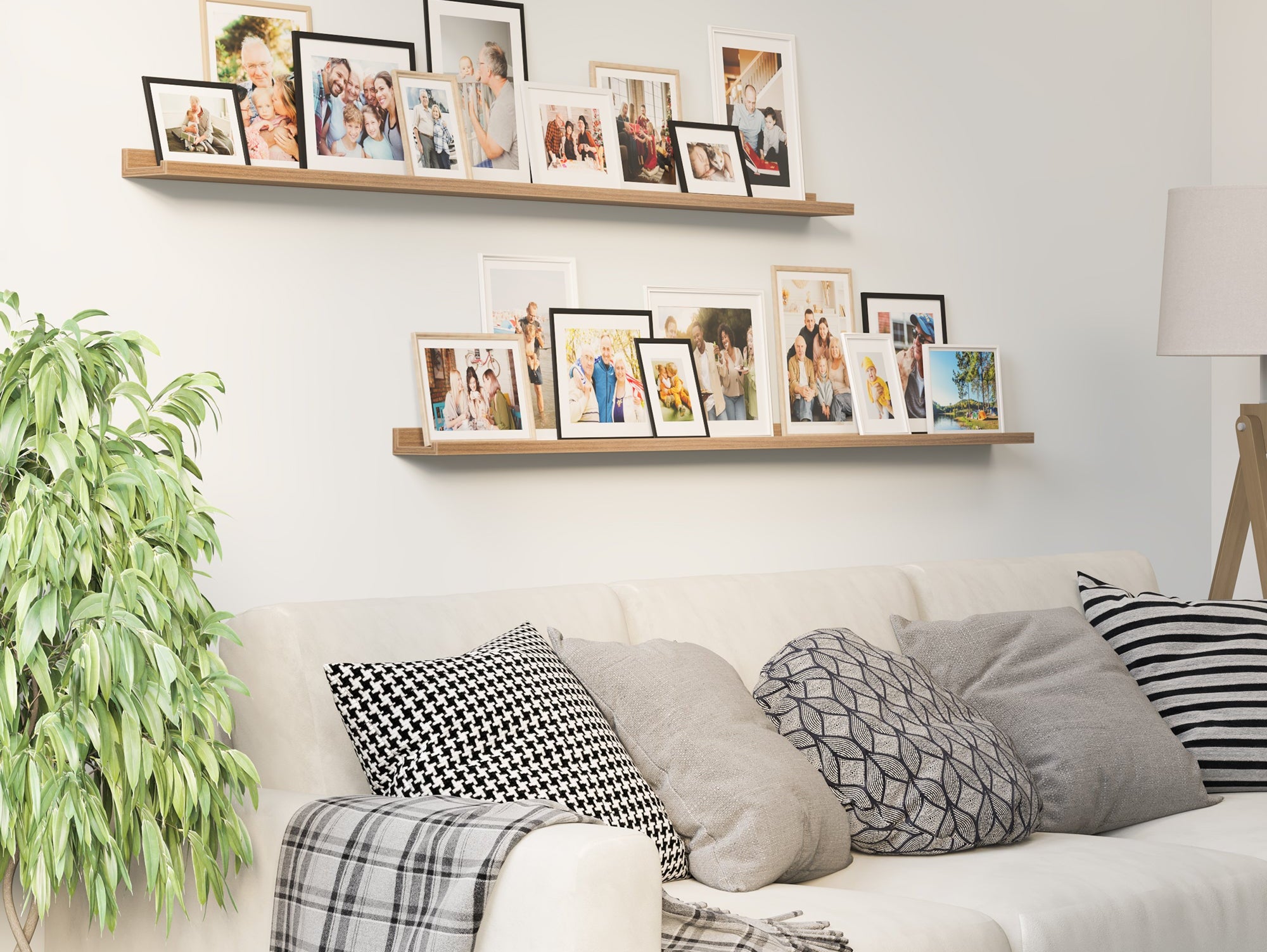Layered picture ledge display with DENVER walnut ledges styled above a console table