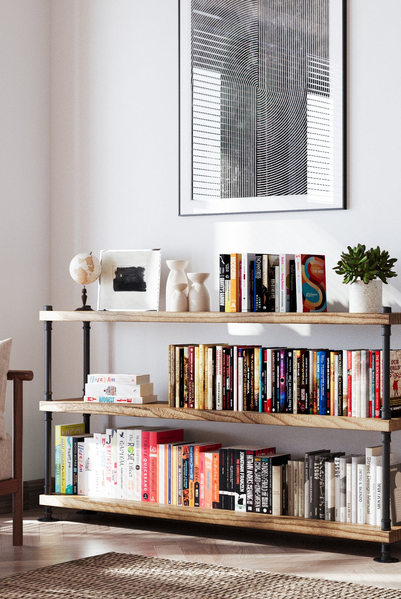 Wallniture PIPE bookcase with burnt wood boards and black pipe frame in a loft-style living room