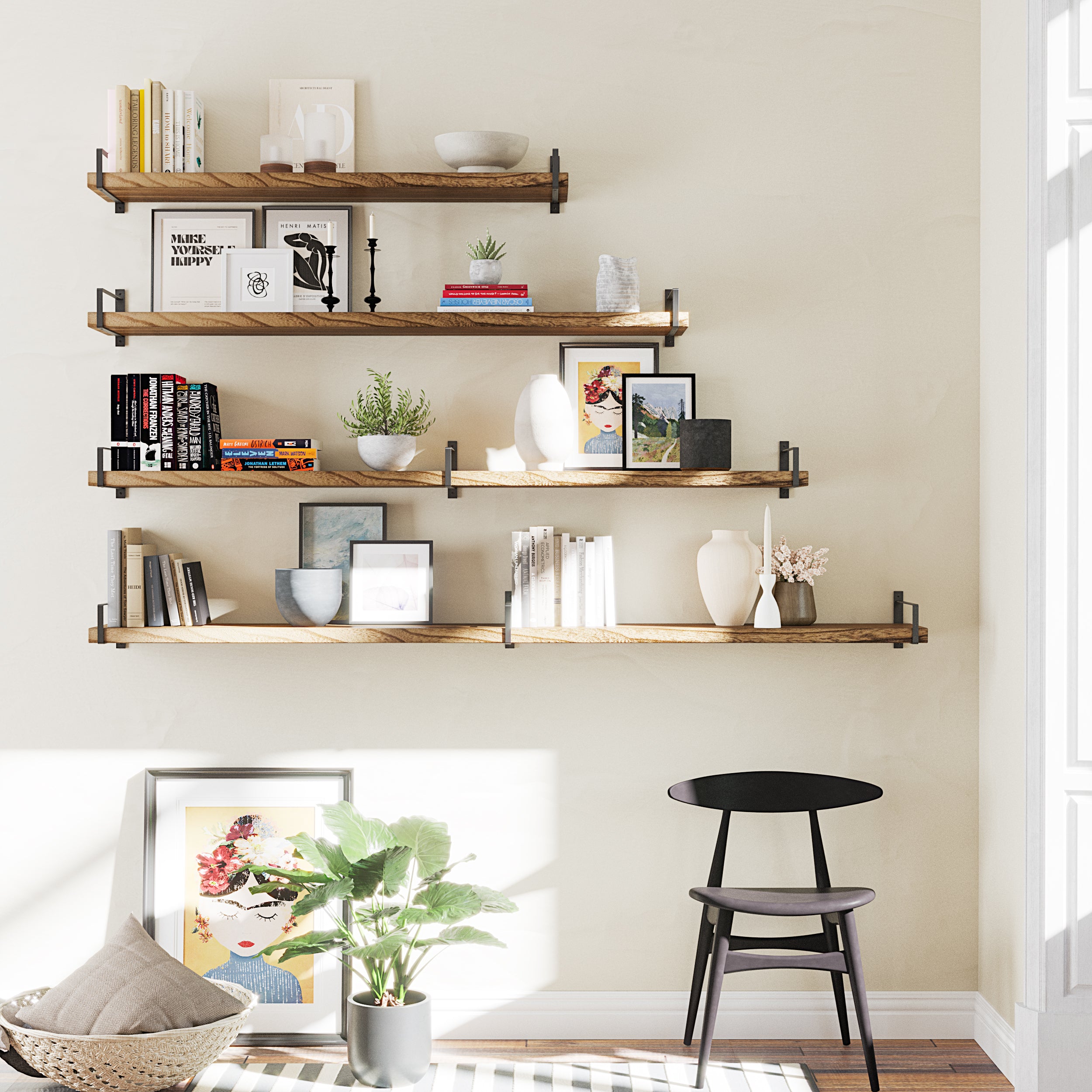 A stylish staggered shelf layout with five rustic wood shelves mounted with black metal brackets. Displayed with art, books, vases, and minimal decor, creating an eye-catching accent wall above a black chair.