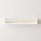 The wall shelf in a minimalist setup, highlighting its clean lines and modern design. The white shelf and natural wooden rod create a versatile piece that fits various home decor styles.
