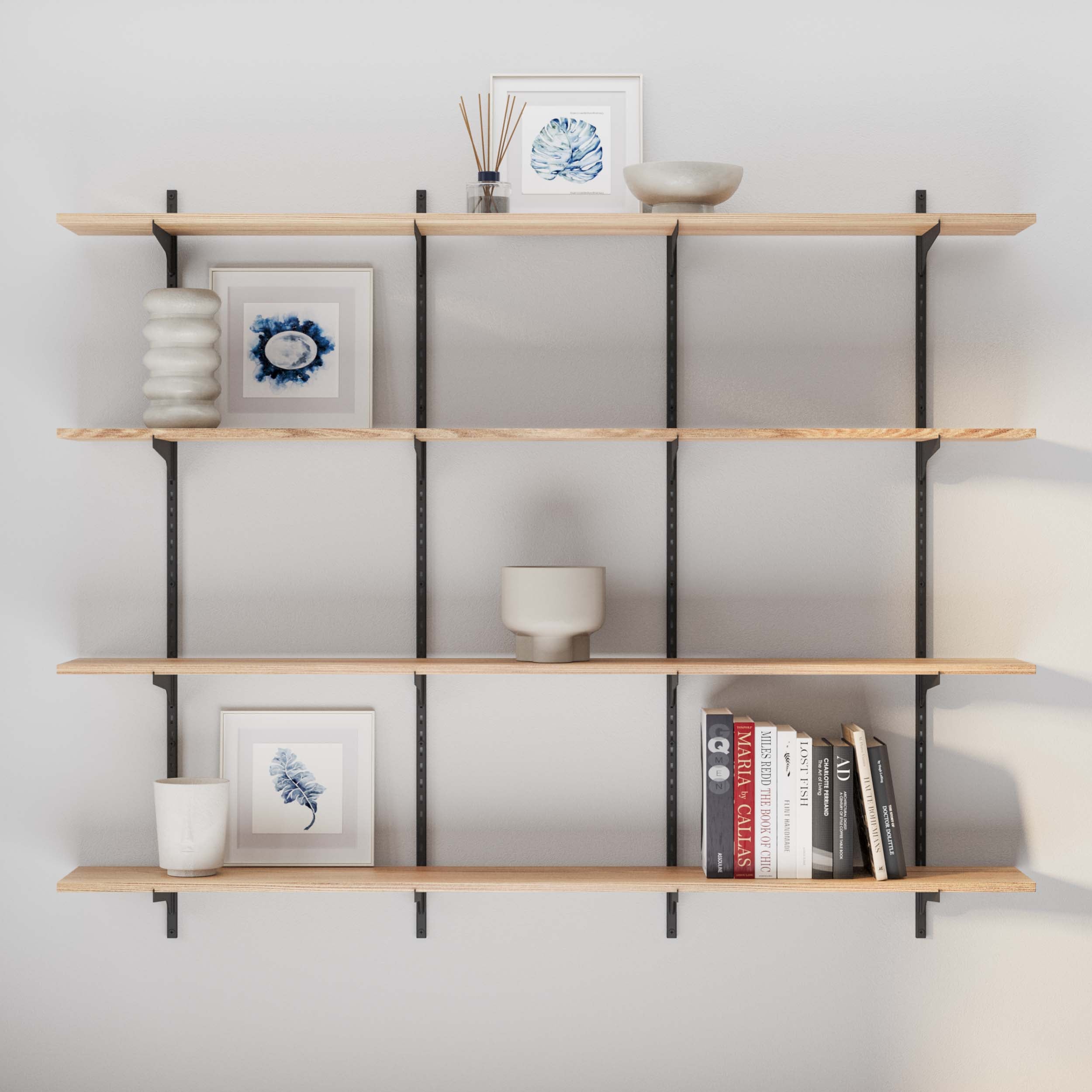A stylishly arranged adjustable shelf burnt color with decorative items like ceramic vases and framed blue botanical prints, set against a simple and modern backdrop.