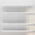 Empty white floating shelves installed on a gray wall, clean and ready for items.