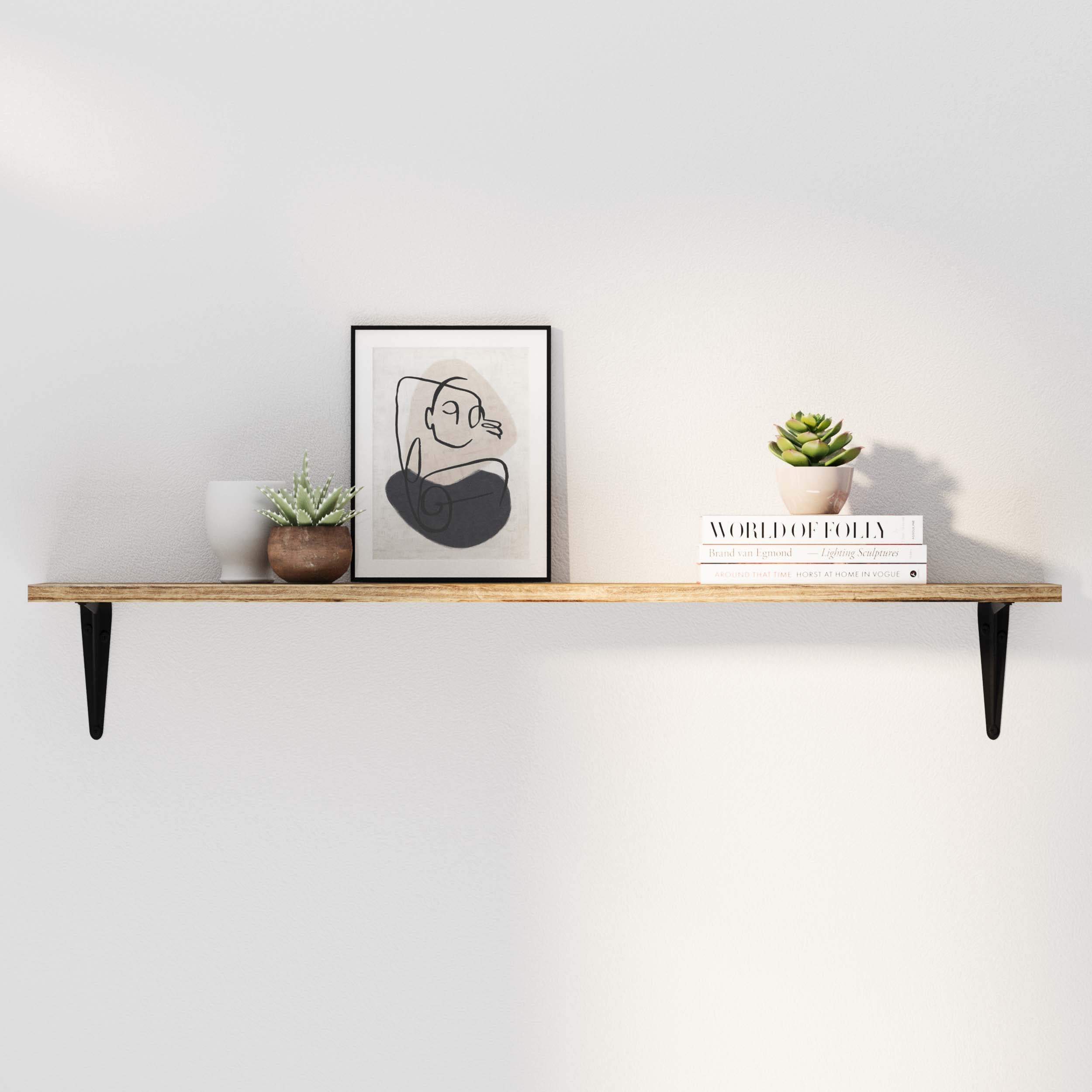 A minimalist wood wall shelf styled with a modern abstract frame, a white vase, and small succulents. Clean and elegant wall decor with functional storage.