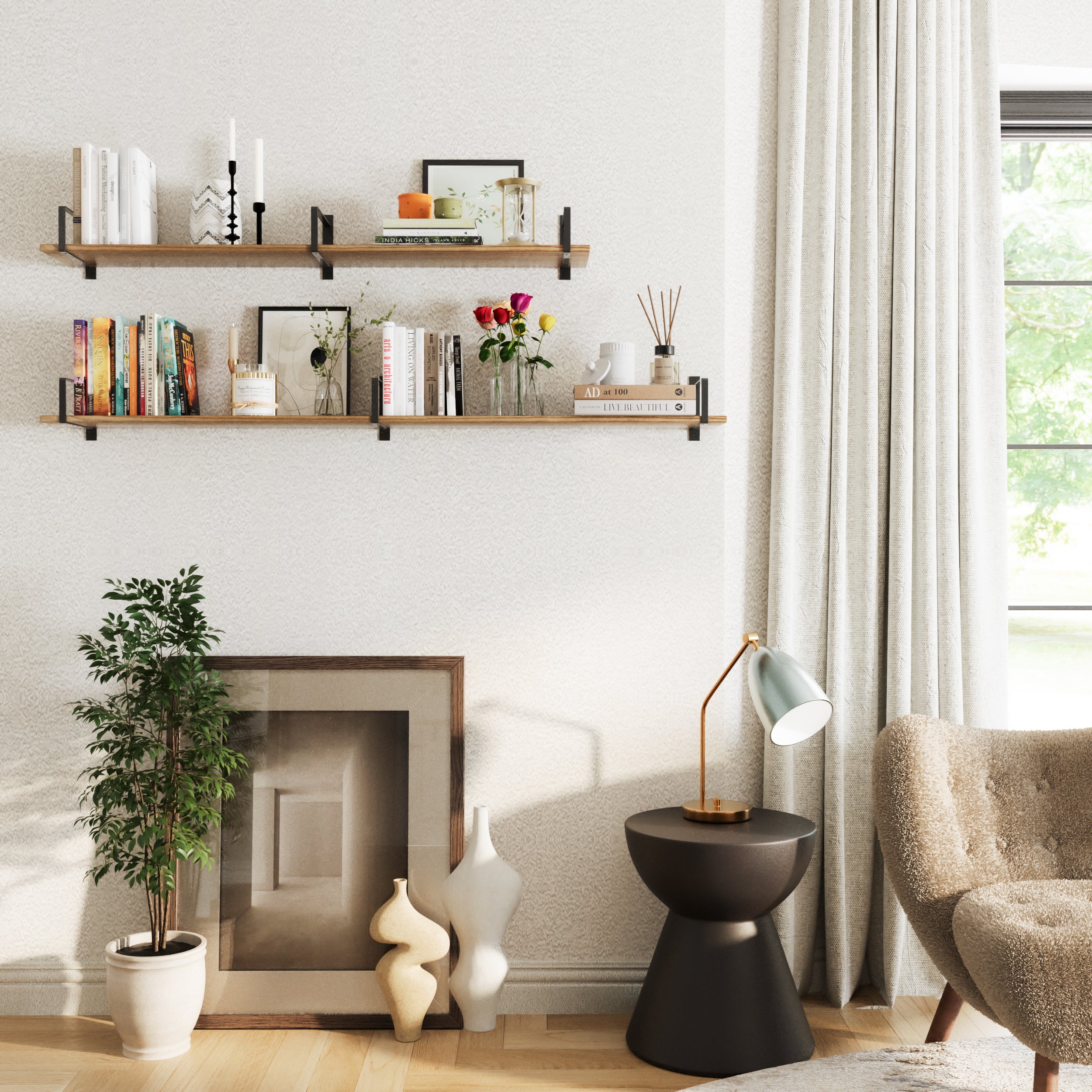A modern living room setup with two floating bookshelves mounted on a white wall, styled with books, vases, candles, and artwork, complemented by a black side table, cozy chair, and potted plants.