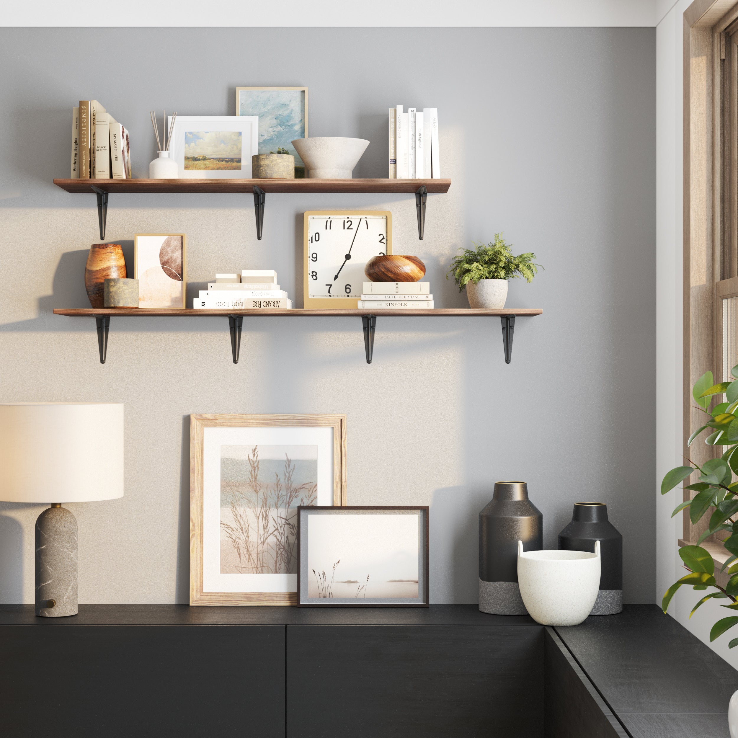 Two-tier wall shelf setup with different length and classic black brackets holding dark-toned wood shelves. Decorated with books, a clock, ceramics, and greenery, perfect for living room or entryway wall styling.