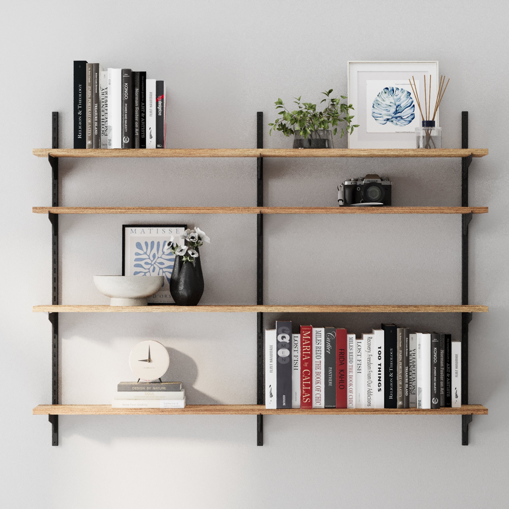 4 tier farmhouse shelves in burnt finish with books, decor items, and a plant against a gray wall.