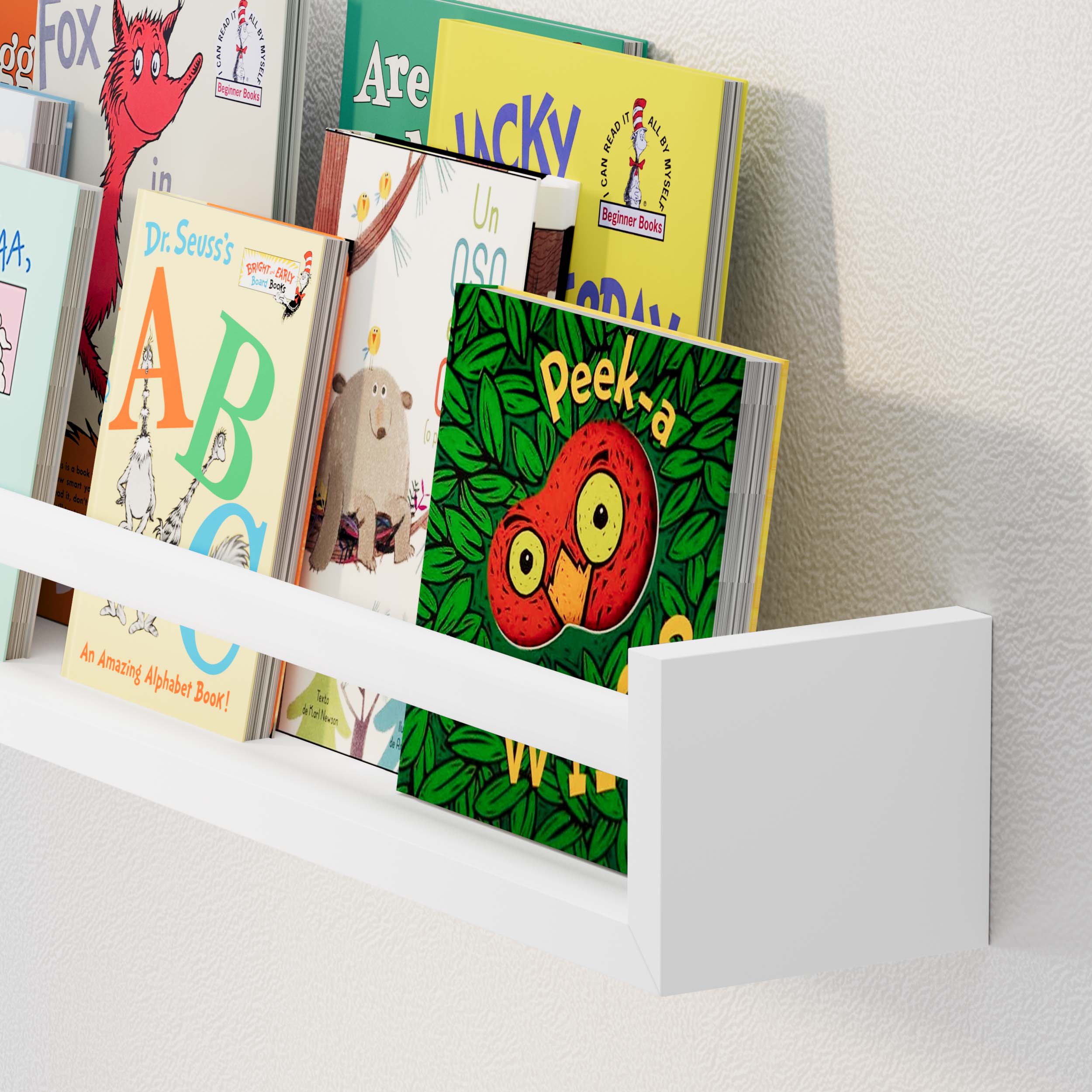 A close-up of the white floating shelf nursery is displayed with various children's books, showcasing its suitability for a nursery or kids' room.