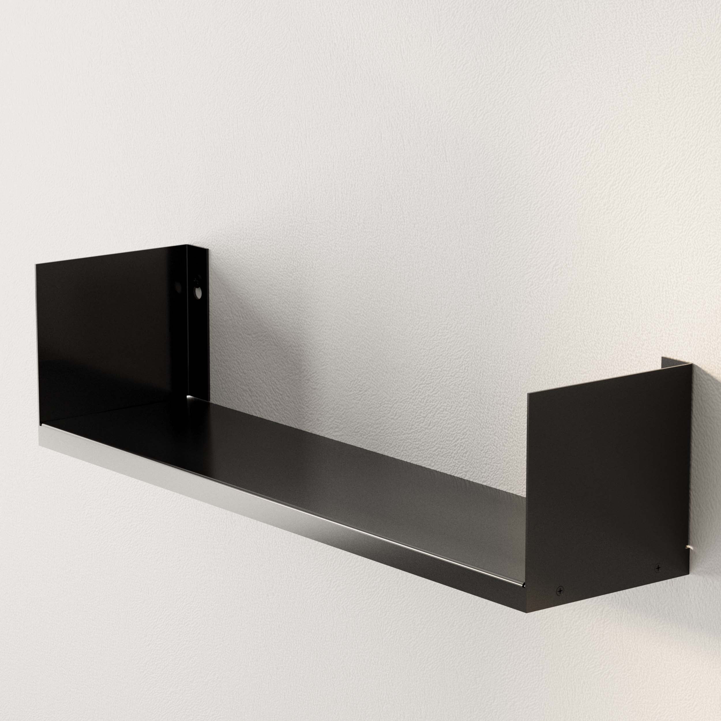 The sleek metal U-shaped black wall shelf, mounted on the wall, offers a minimalist look, ready to hold and display your favorite decor pieces or functional items.