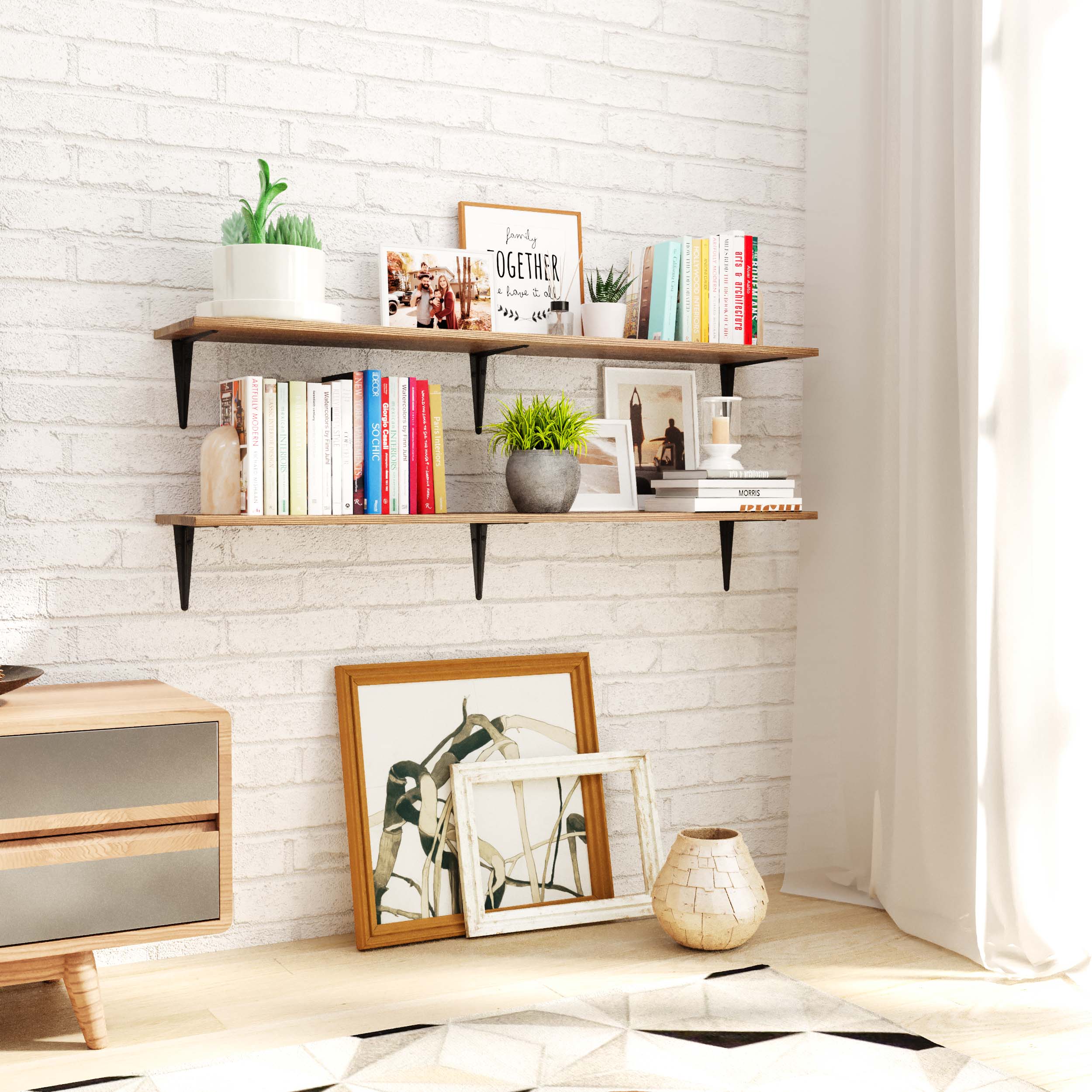 Pair of warm-toned rustic wall shelves mounted to a white brick wall, filled with colorful books, photo frames, and planters. Great for cozy reading nooks or personal display walls.