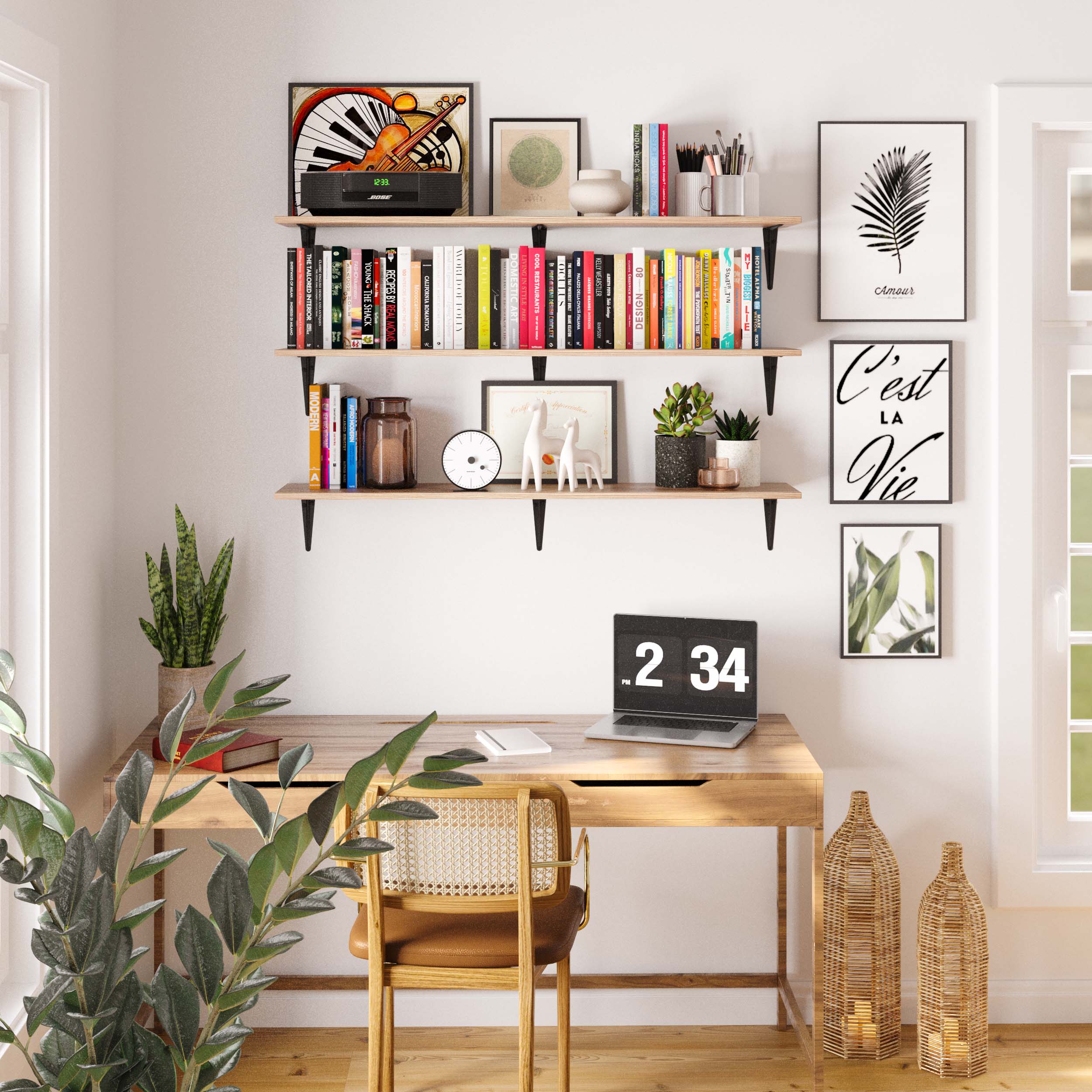 Stylish home office wall with triple office shelf layout above a wooden desk. Shelves hold a mix of books, framed art, and decor, creating an organized and inspiring workspace with natural lighting.
