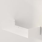 A sleek, white wall-mounted metal shelf, ideal for adding a modern touch to your living space. Sturdy and stylish for any room.