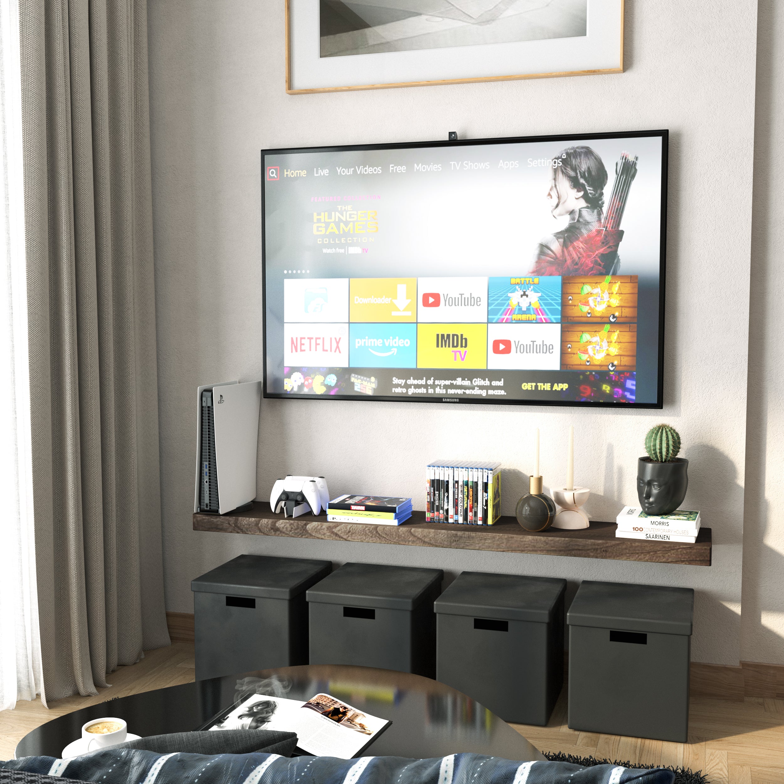 A 60 inch long hidden bracket shelf in a rich dark walnut finish below a wall-mounted TV holds media items and decorative objects. Black cube storage and neutral tones complete the entertainment nook.