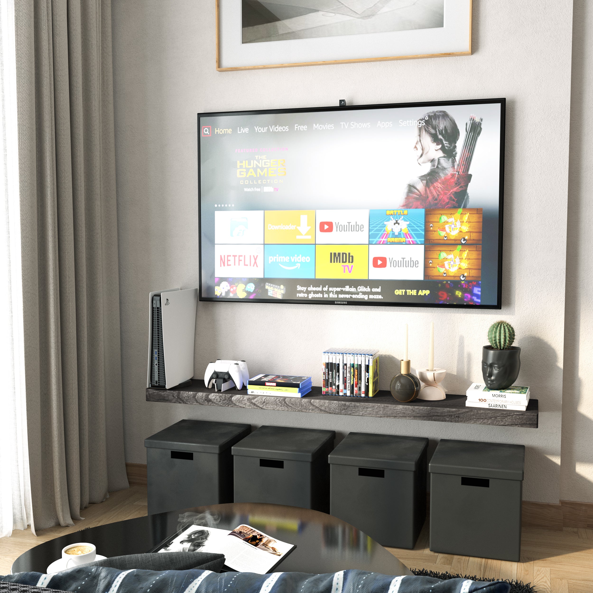 A 60 inch long wall shelf for living room decor with hidden bracket in ebony finish below a wall-mounted TV holds media items and decorative objects. Black cube storage and neutral tones complete the entertainment nook.