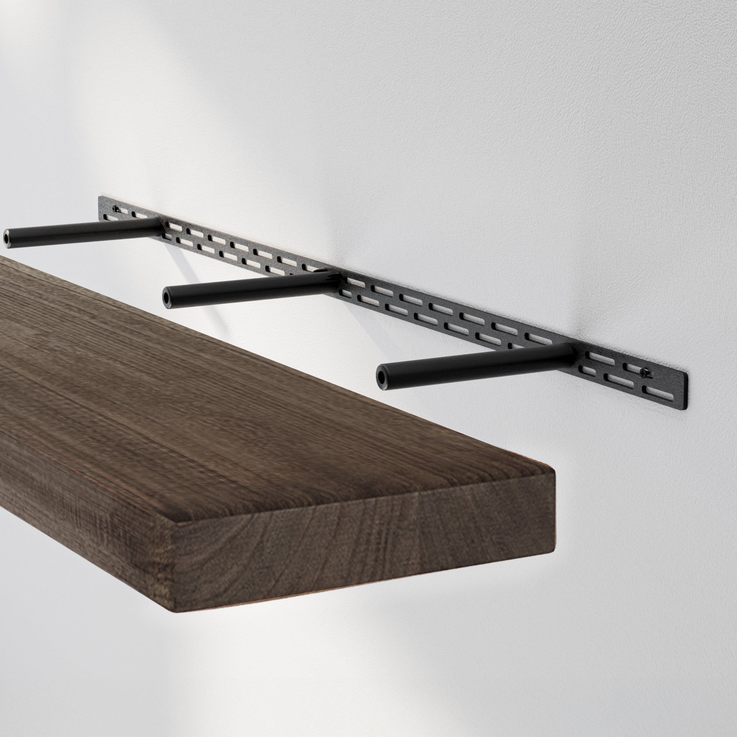 A floating shelf with a black hidden bracket system with metal rods extending from a slotted steel mount, supporting a 2'' thick rustic shelf with a dark walnut finish for a clean, floating wall shelf look.