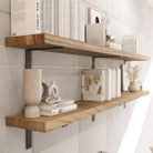 Modern living room shelves supported by black metal brackets, perfect for displaying decorative items.