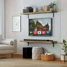 A living room design with two long wall mounted shelves framing a TV. The shelves are used for books, plants, and decor, demonstrating their versatility for entertainment setups and media walls.