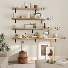 Tiered hanging wood shelves in a pyramid arrangement featuring books and decor like golden swans. The warm tones and artistic elements blend seamlessly with a cozy living room.