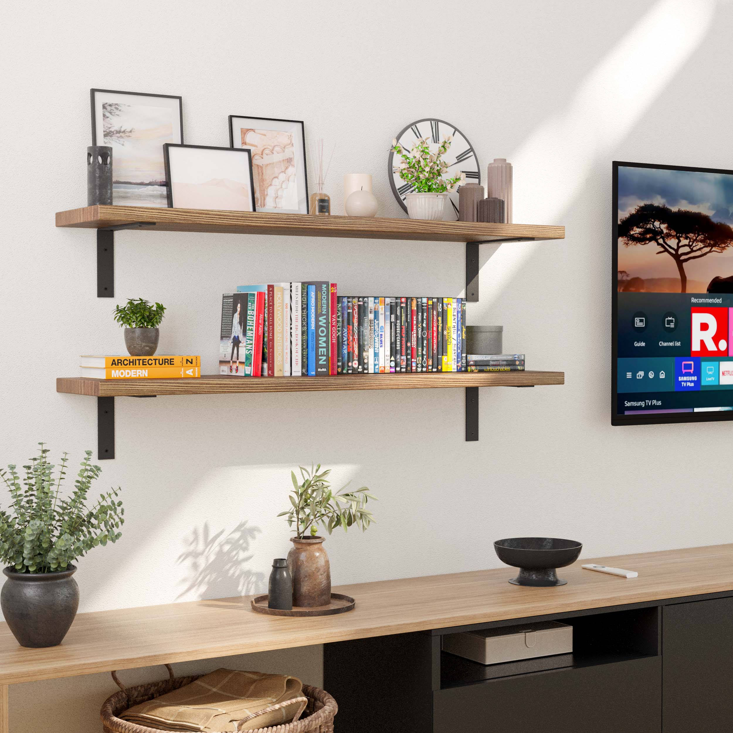 Two floating bookshelves for living room placed in a living room above a TV console, featuring books, plants, and a clock. Demonstrates functionality and space optimization in a modern entertainment area.