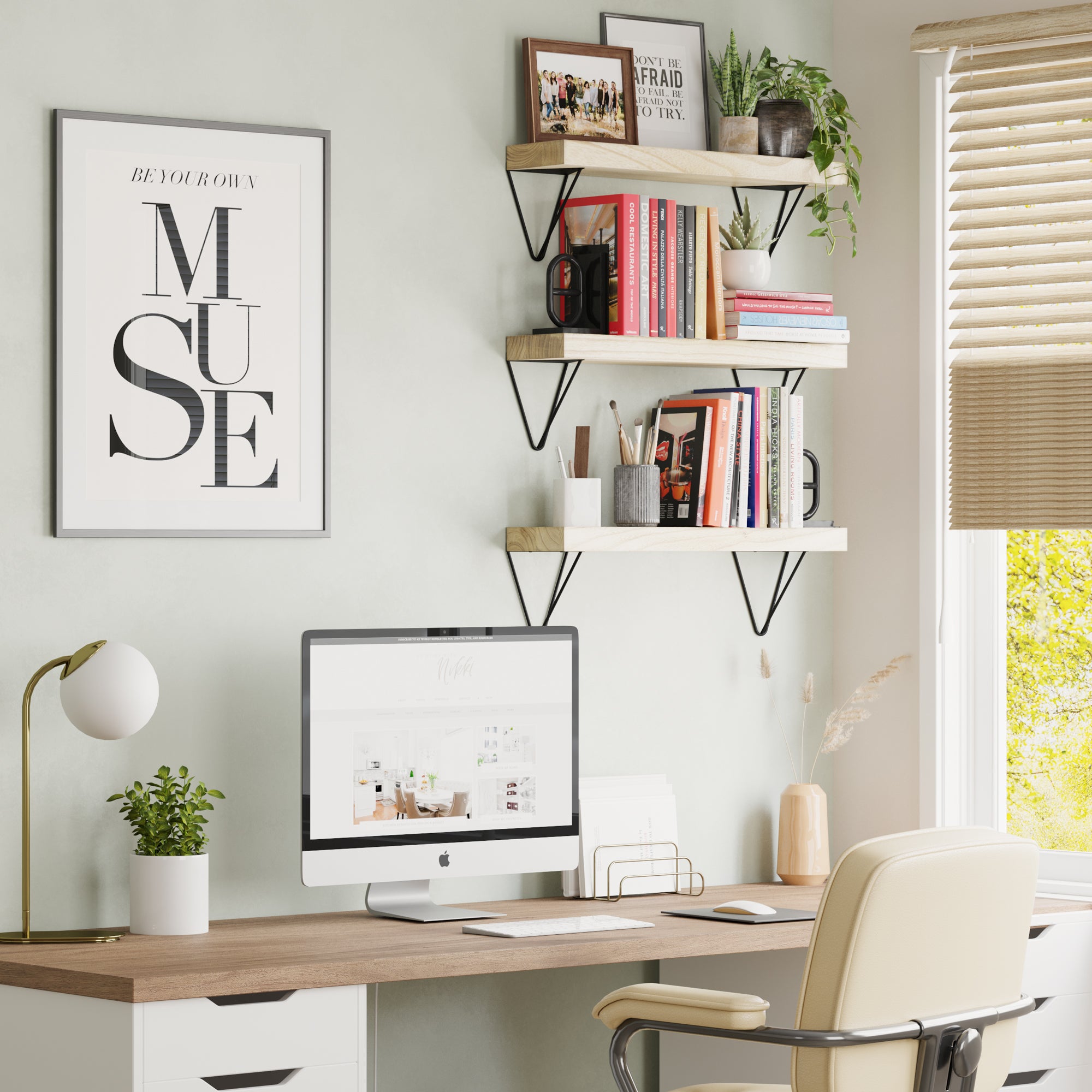 Home office with wooden shelves supported by black triangular metal brackets.