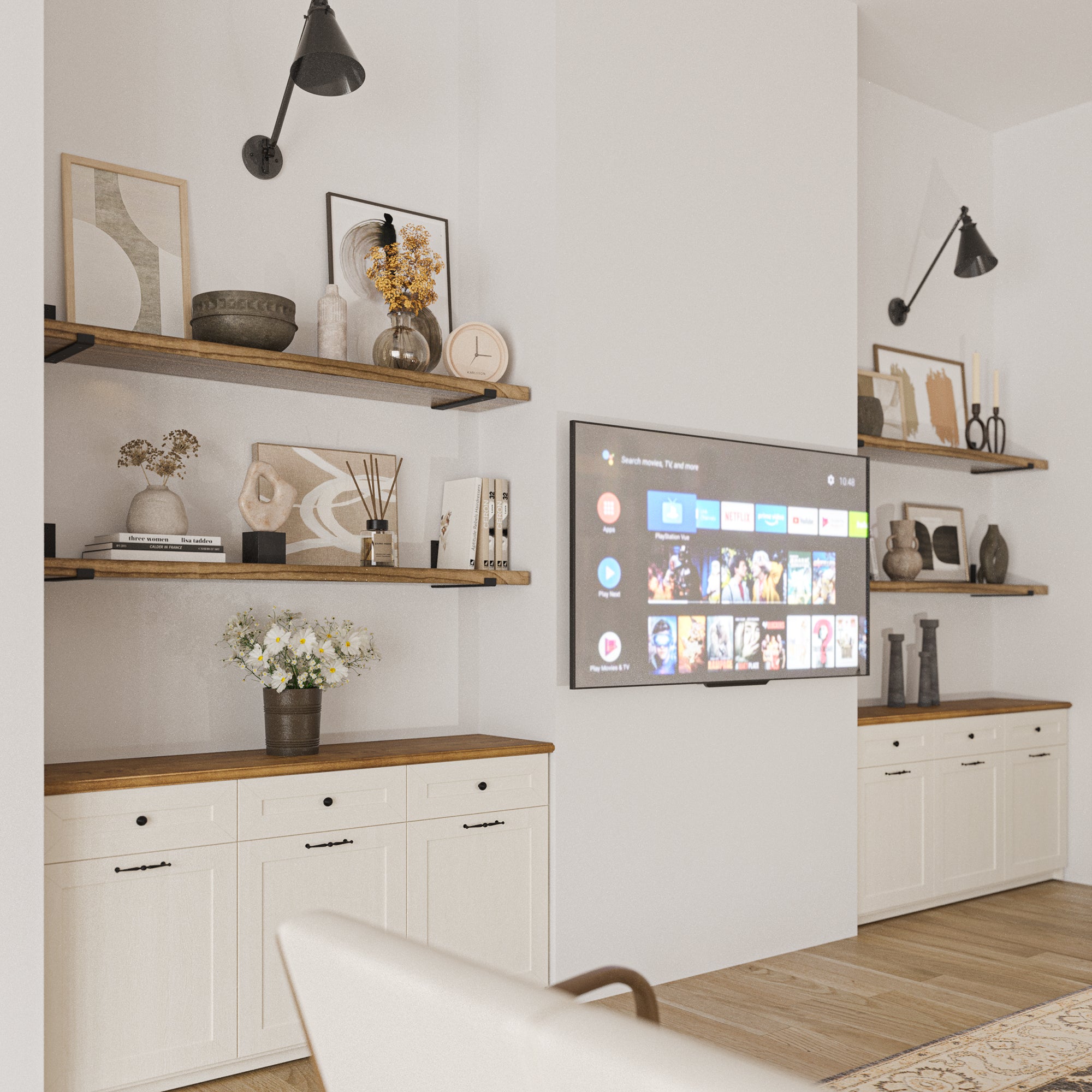 Floating wooden shelves arranged around a wall-mounted TV, styled with a mix of decorative objects and books, lending an inviting feel to the entertainment area.