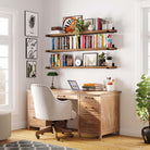 Home office with three wall mounted display shelves exhibiting books, decor, and plants. These hanging shelves enhance organization and aesthetics, making the workspace both functional and visually appealing.