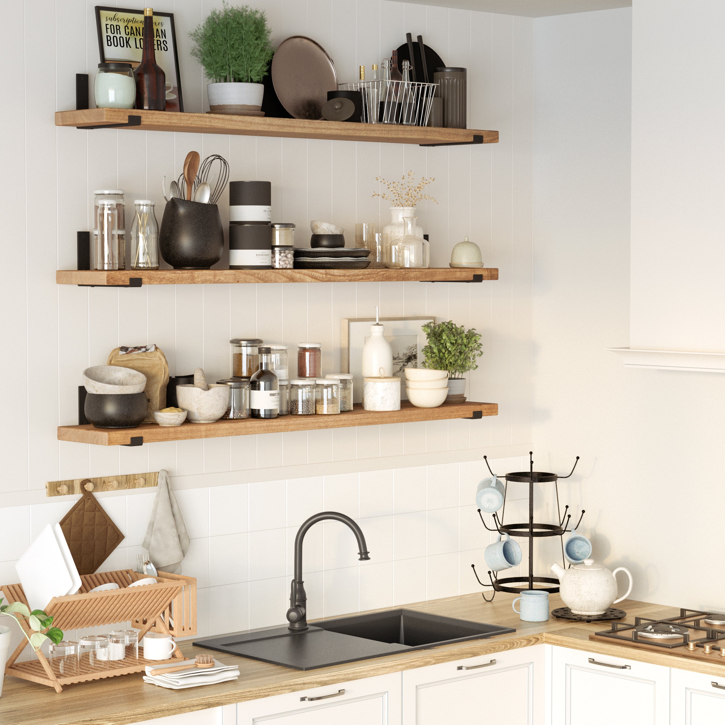 A modern kitchen with three wooden farmhouse shelves holding glass jars, ceramic bowls, utensils, and plants. Below, a black sink with a gooseneck faucet is set on a light wood countertop, with dishware and a stove nearby.
