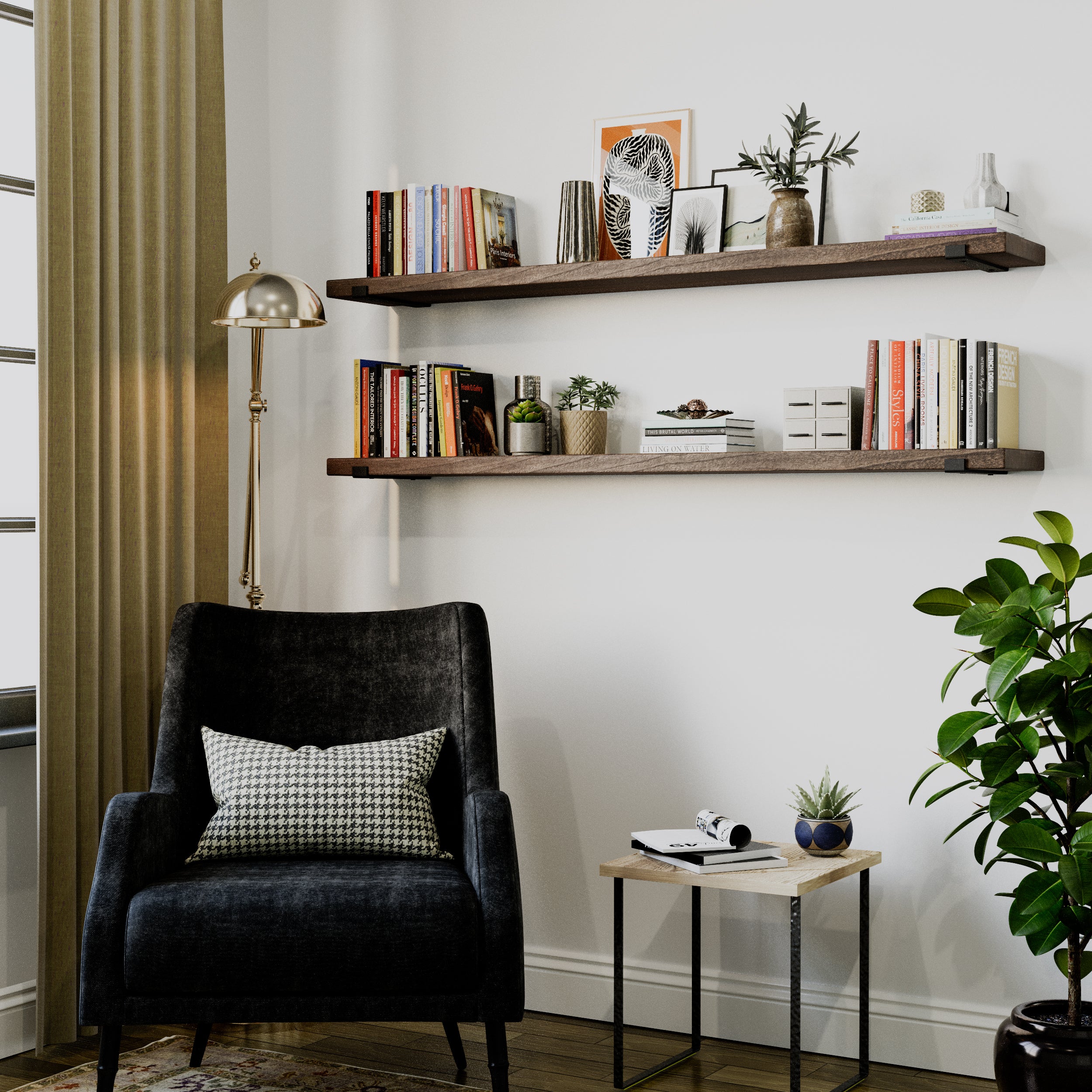 Two espresso-finished long floating shelves hold books, potted plants, and framed art above a black armchair with a gold floor lamp, creating a stylish reading area.