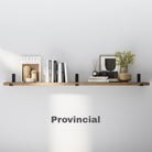 Provincial finish wall shelf styled with neutral décor, books, and a small plant. The rich brown tone brings warmth and character to the wall, pairing effortlessly with black metal brackets.