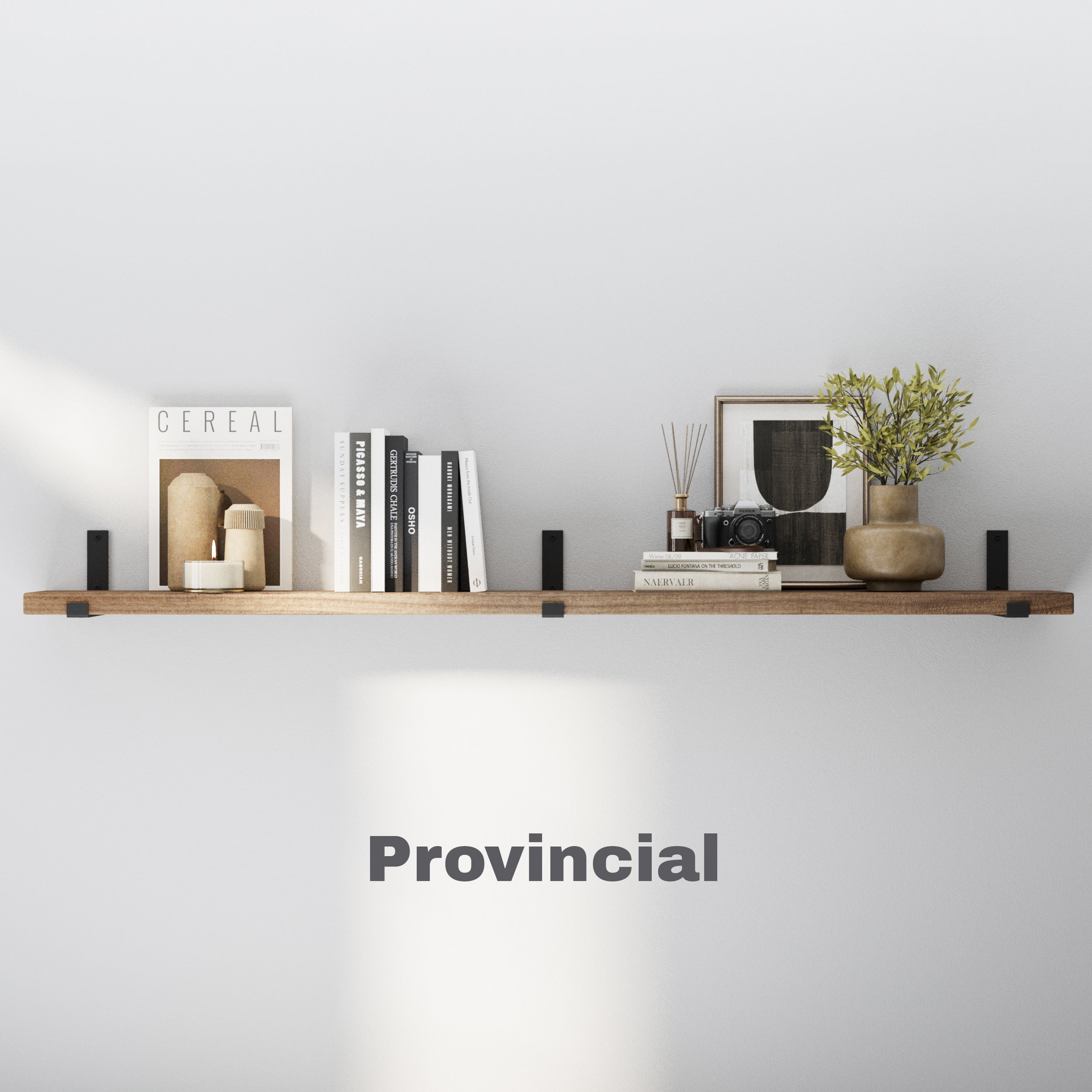 Provincial finish wall shelf styled with neutral décor, books, and a small plant. The rich brown tone brings warmth and character to the wall, pairing effortlessly with black metal brackets.
