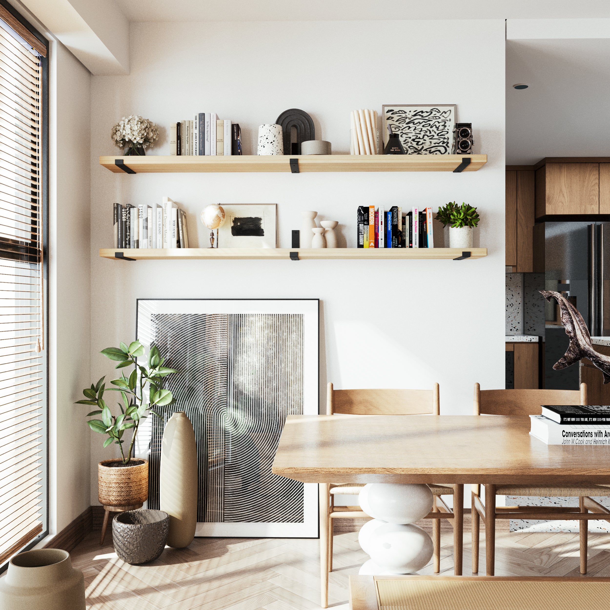 Natural finish hanging shelves float above a light wood dining set, decorated with art and books. The tone blends seamlessly with the modern, airy interior aesthetic.
