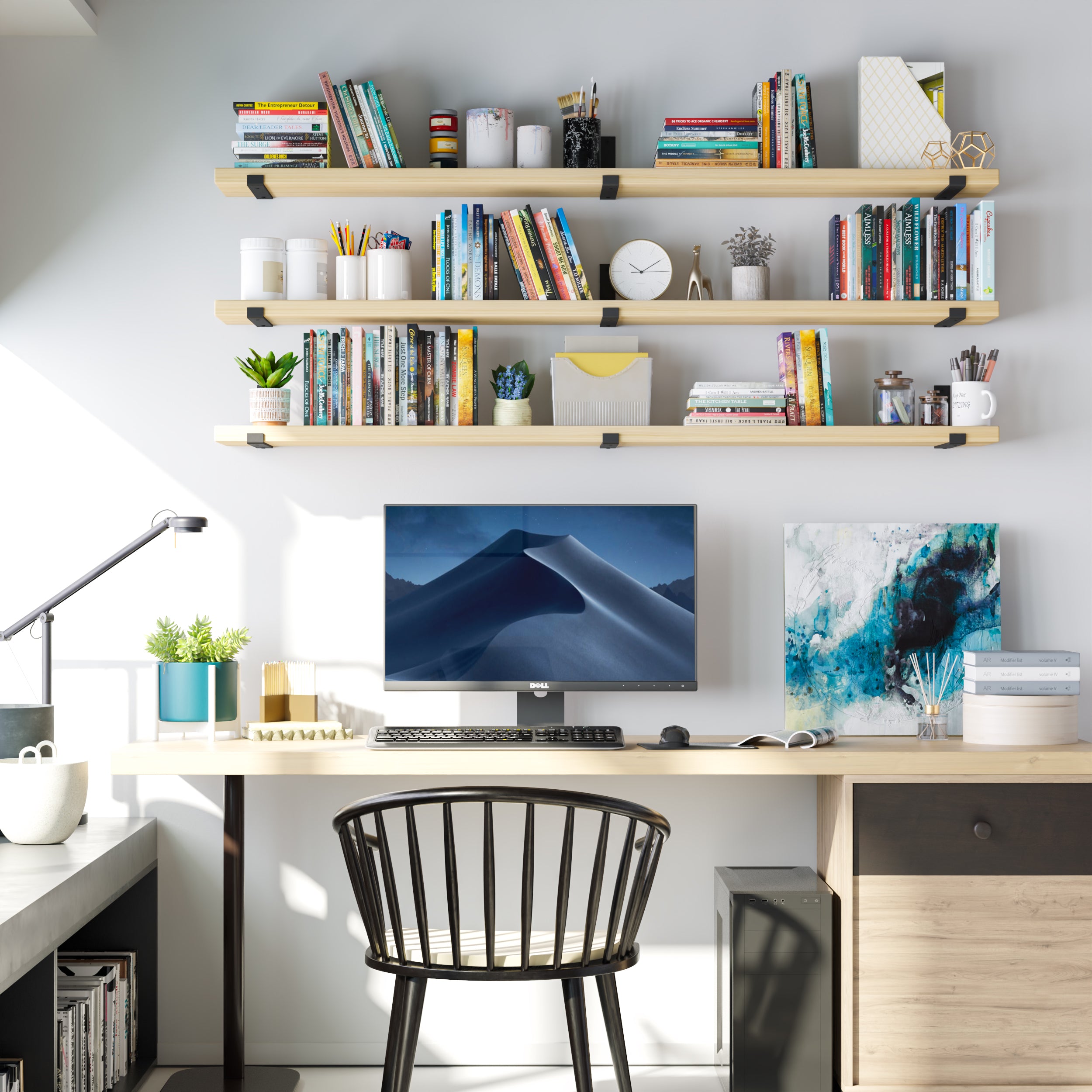 A productive home office features triple-tiered Natural finish shelves packed with books and decor. The warm tone pairs beautifully with the bright and modern desk setup.