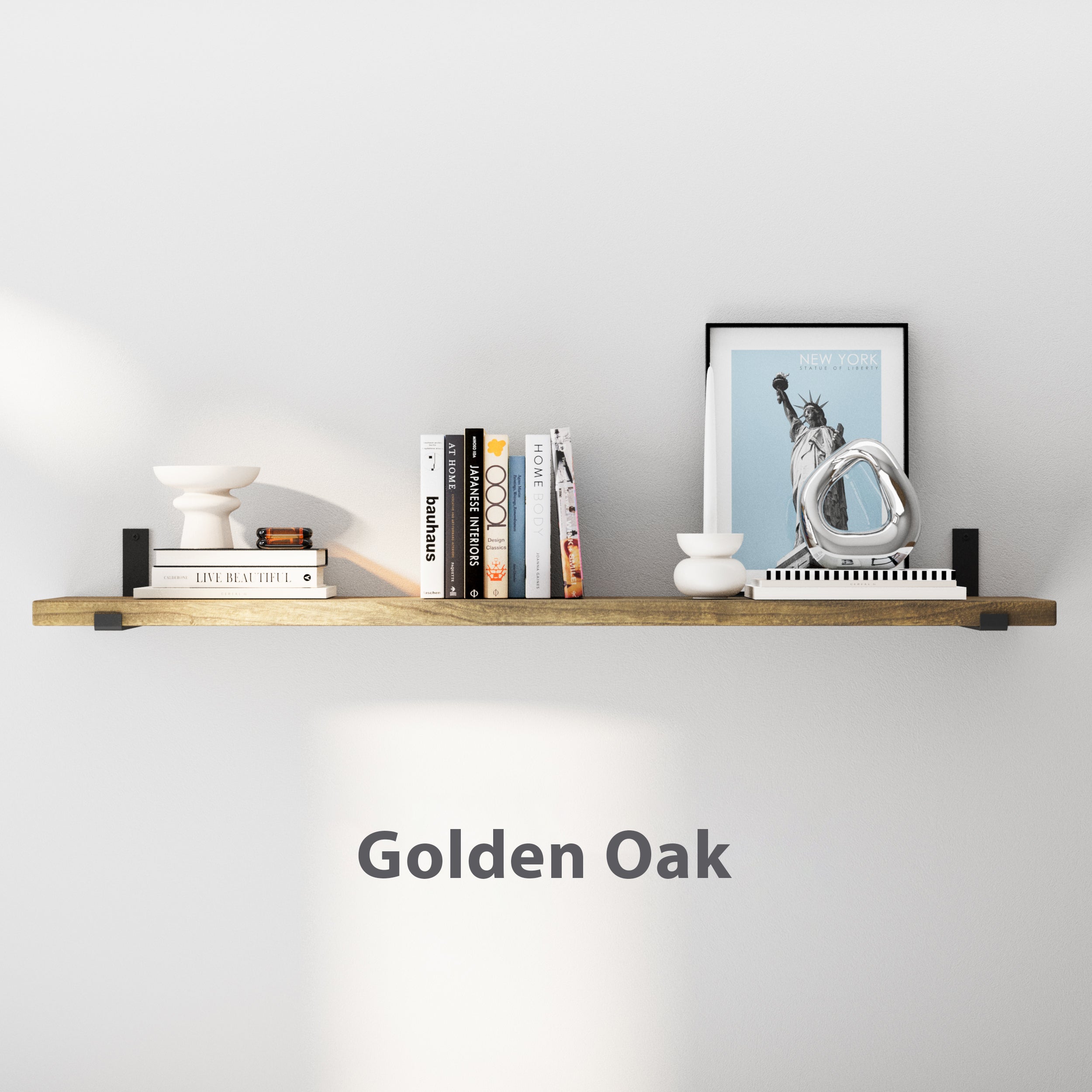 60 inch long real wood hanging shelf with a warm Golden Oak finish and 11.25" wide heavy duty shelf brackets, creating rustic wall storage for books, framed art, candles, and décor. A durable industrial pipe shelf that blends farmhouse, modern, and industrial styles.