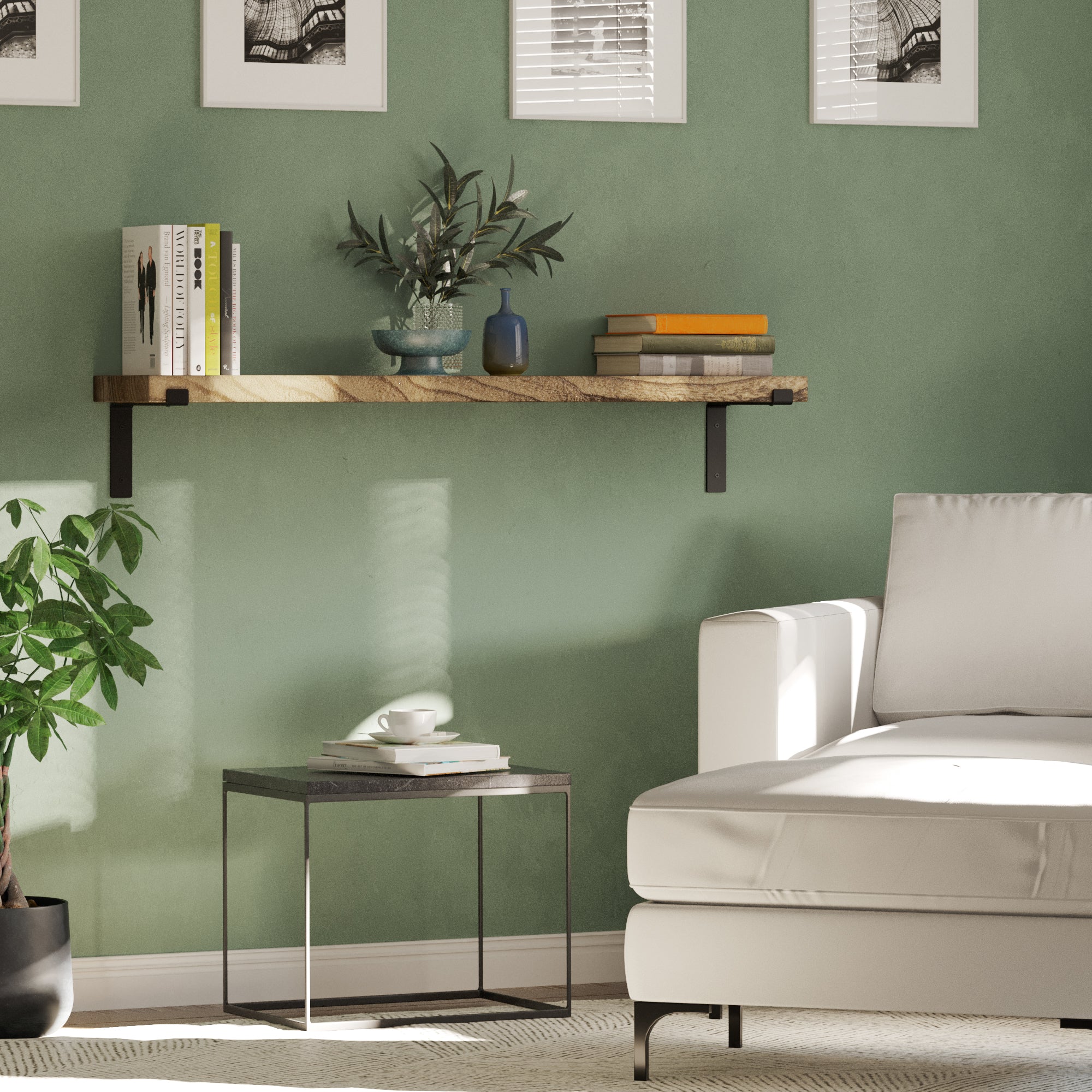 A single floating wall bookshelf mounted on a green wall, styled with books, plants, and a small decorative vase in a minimalist setting.