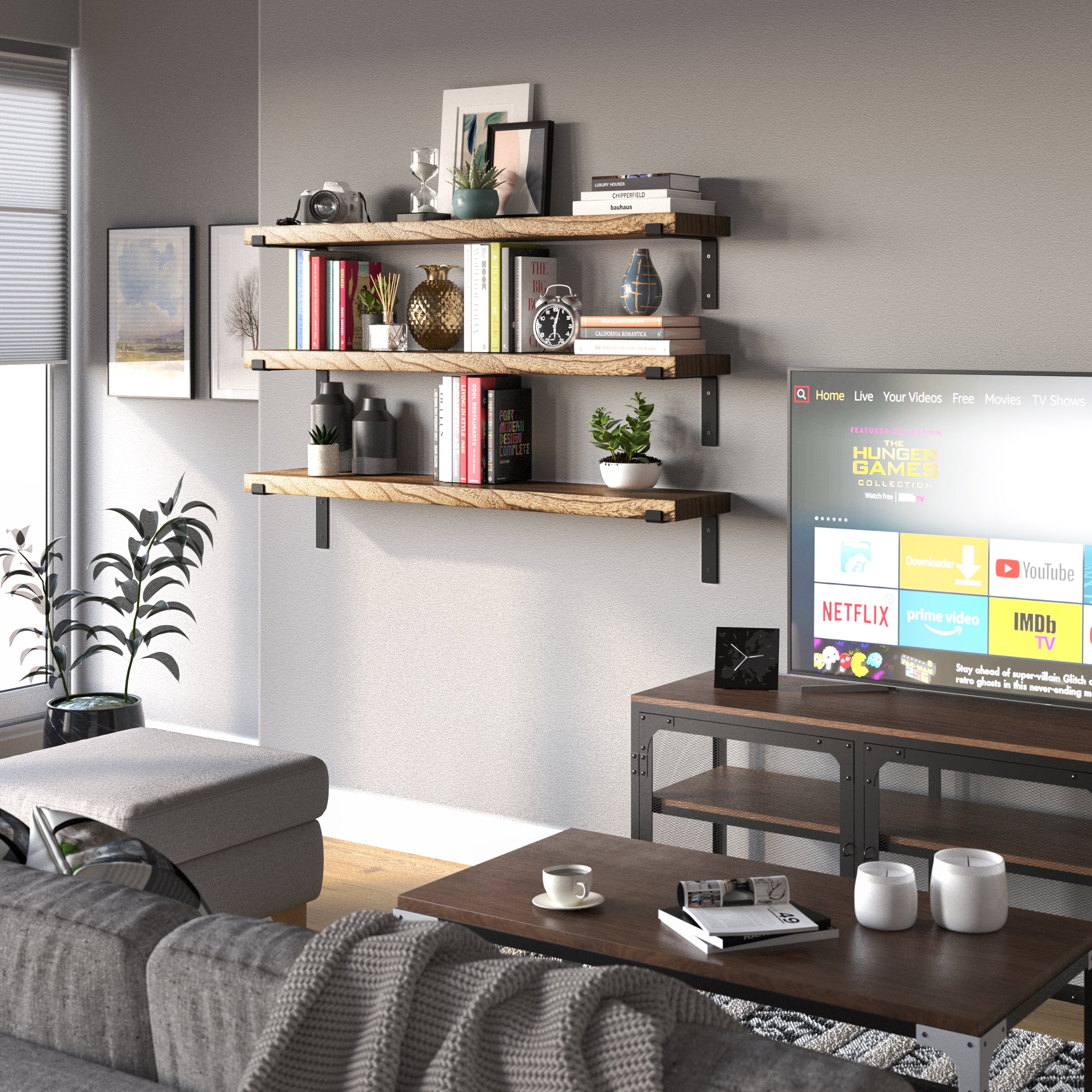 A 48" long display shelf for living room decor with black brackets, holding books, a clock, decorative vases, and a framed picture against a white wall.