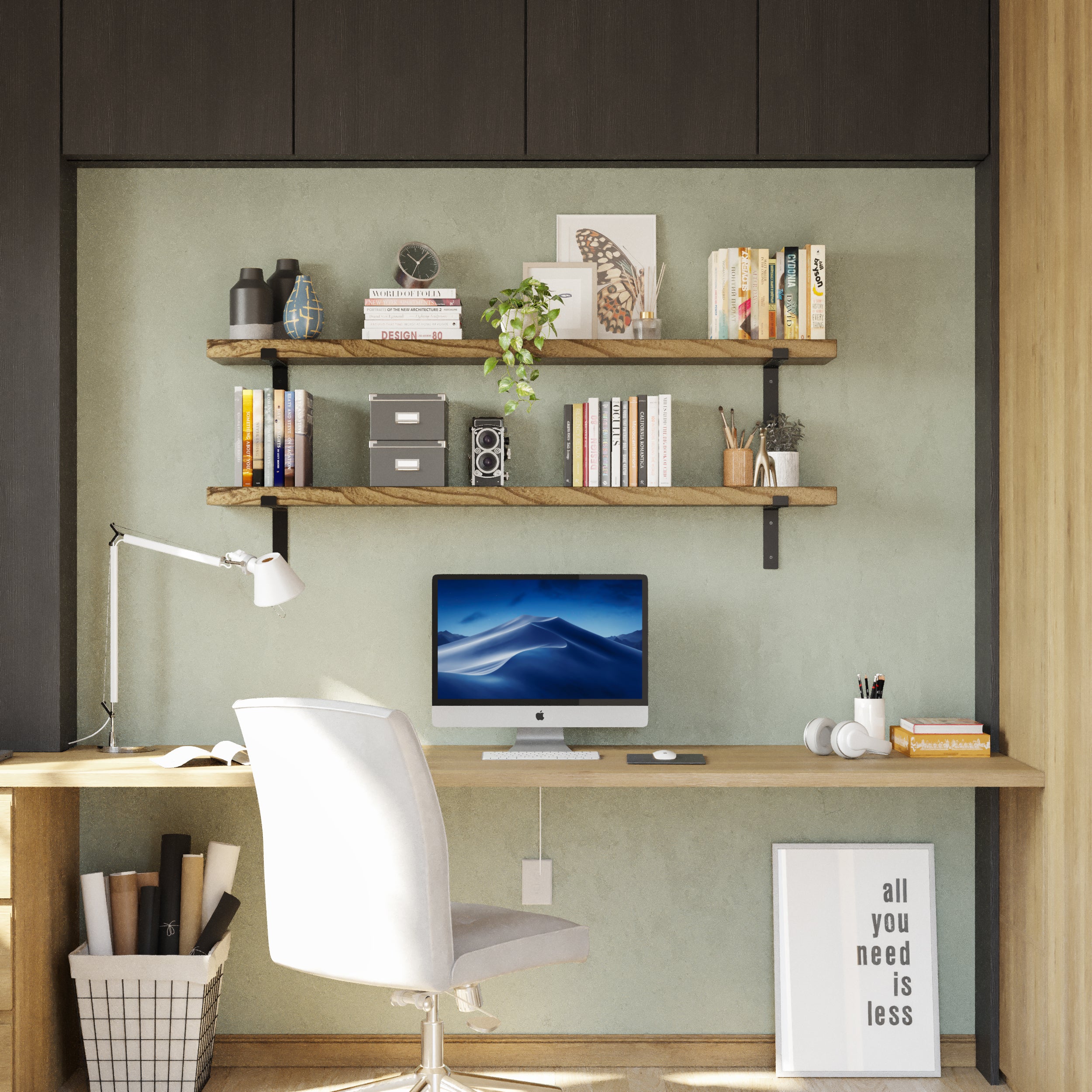 Two floating office shelves above a workspace with a Mac, books, plants, and decor.