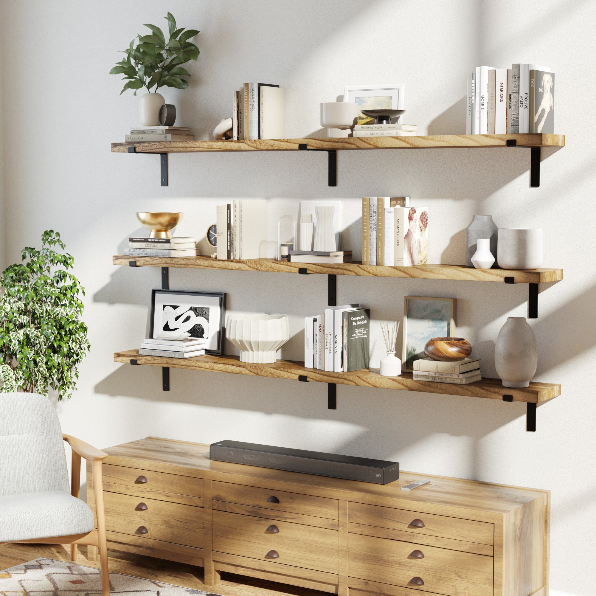 Three wooden display shelves in a cozy room, filled with books, ceramics, and plants, creating a stylish and functional display.