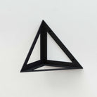 Modern triangular black metal shelf bracket for stylish and sturdy wall-mounted shelves.