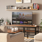 60 inch long wall  bookshelf is mounted above a TV in a cozy living room setup. It holds books, decorative items, and small electronics, demonstrating its versatility and ability to complement various styles of home decor.