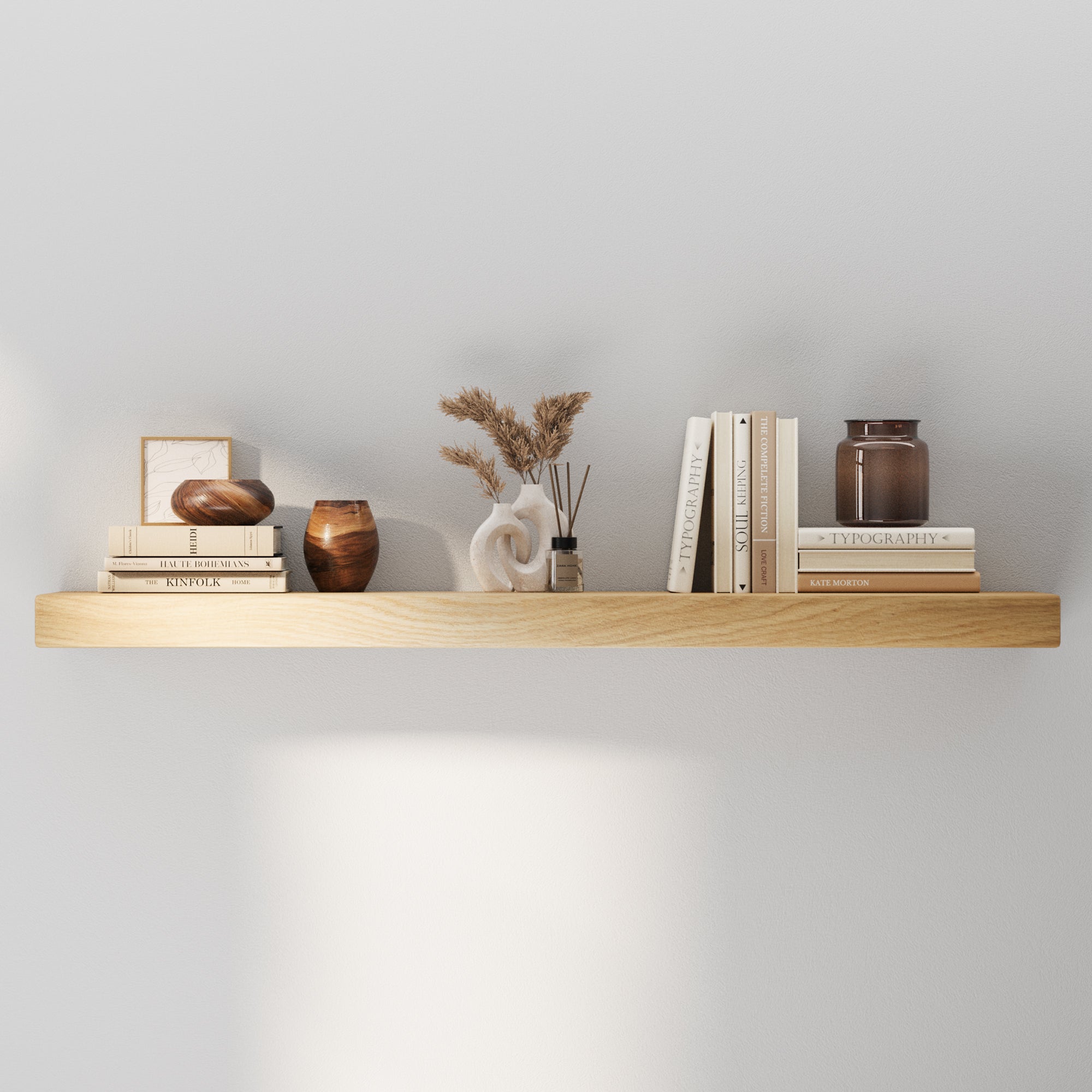 Minimalist front view of the floating shelf with hollow structure and invisible metal bracket styled with neutral-toned books, vases, and dried florals—highlighting its natural wood finish and clean silhouette.