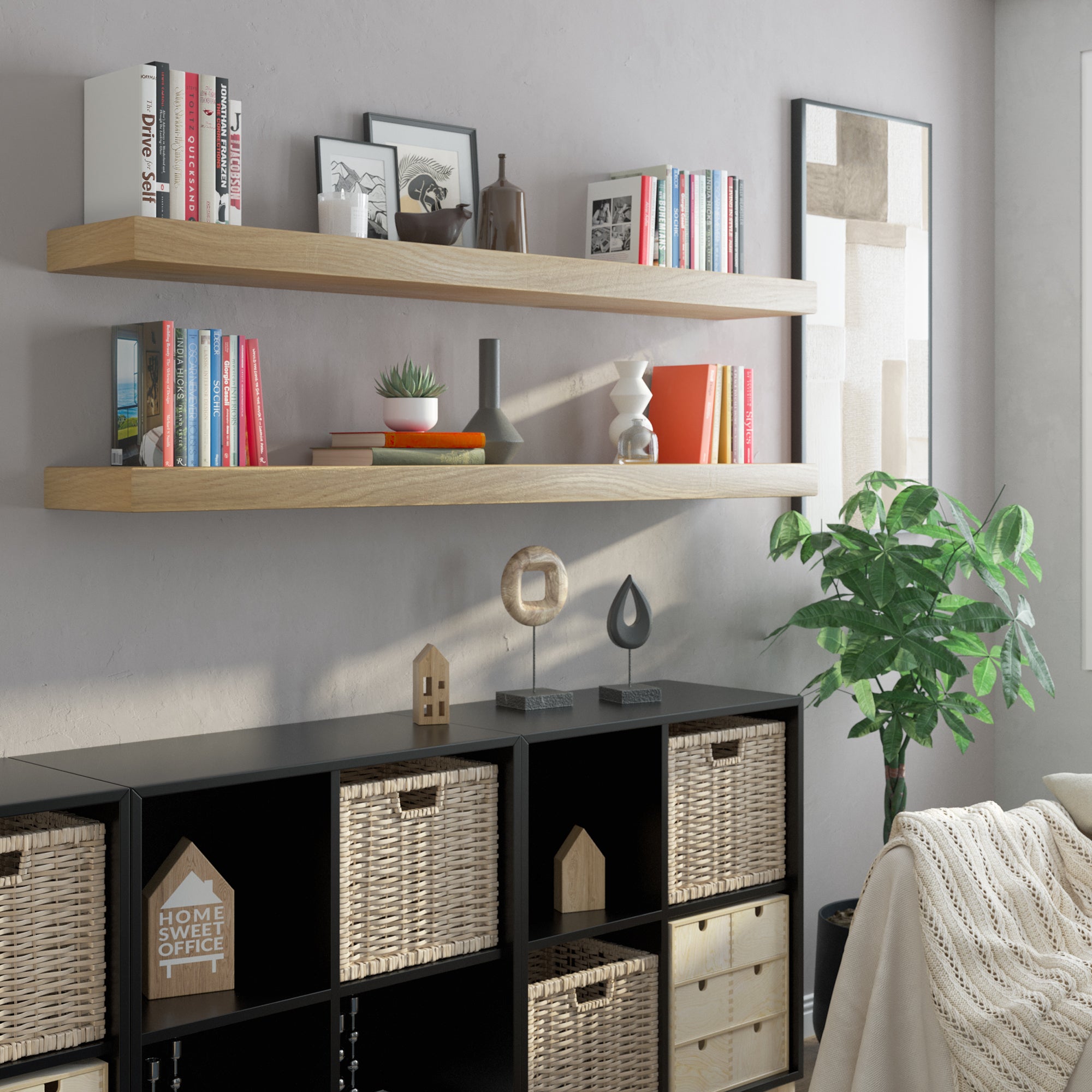 Lifestyle setup with two floating shelves with hidden bracket above a storage console. Perfect for home offices or living spaces, showcasing books and decorative accents.