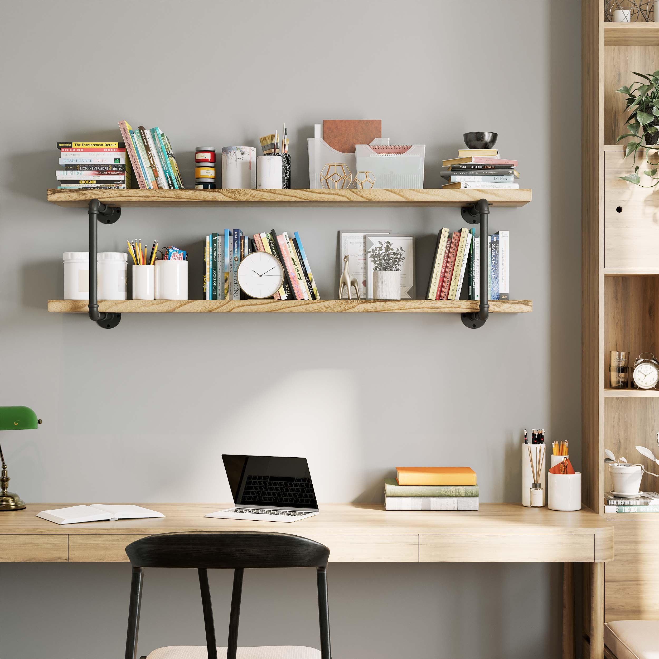 Hanging shelves 2 tier burnt color above a desk, filled with books, decor, and office supplies.