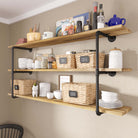 3 tiered pipe shelves rustic holding bathroom essentials.