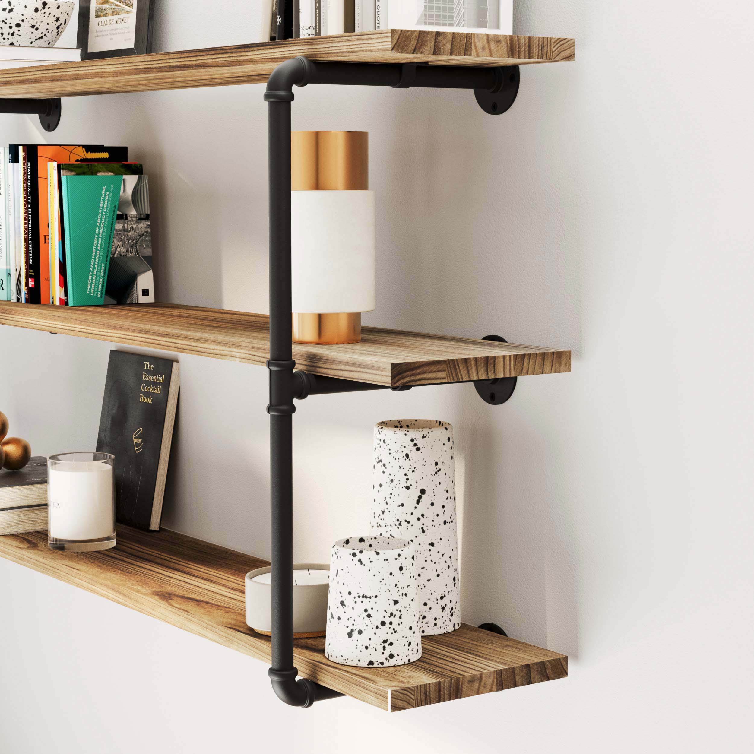 Close-up of industrial pipe shelves 3 tiered and burnt color showcasing books and decor in a stylish setting.