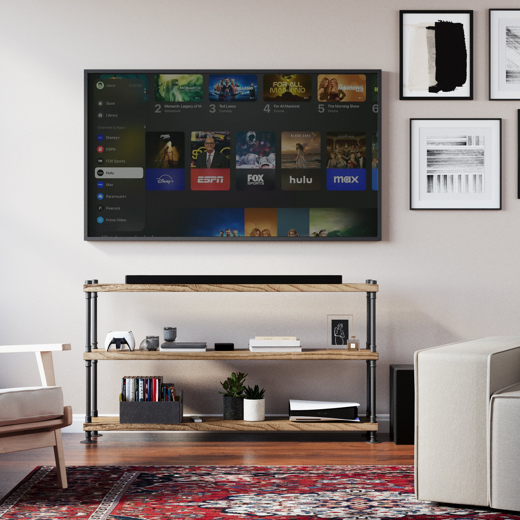 Living room with a television displaying streaming services and an industrial bookcase for living room decor below.