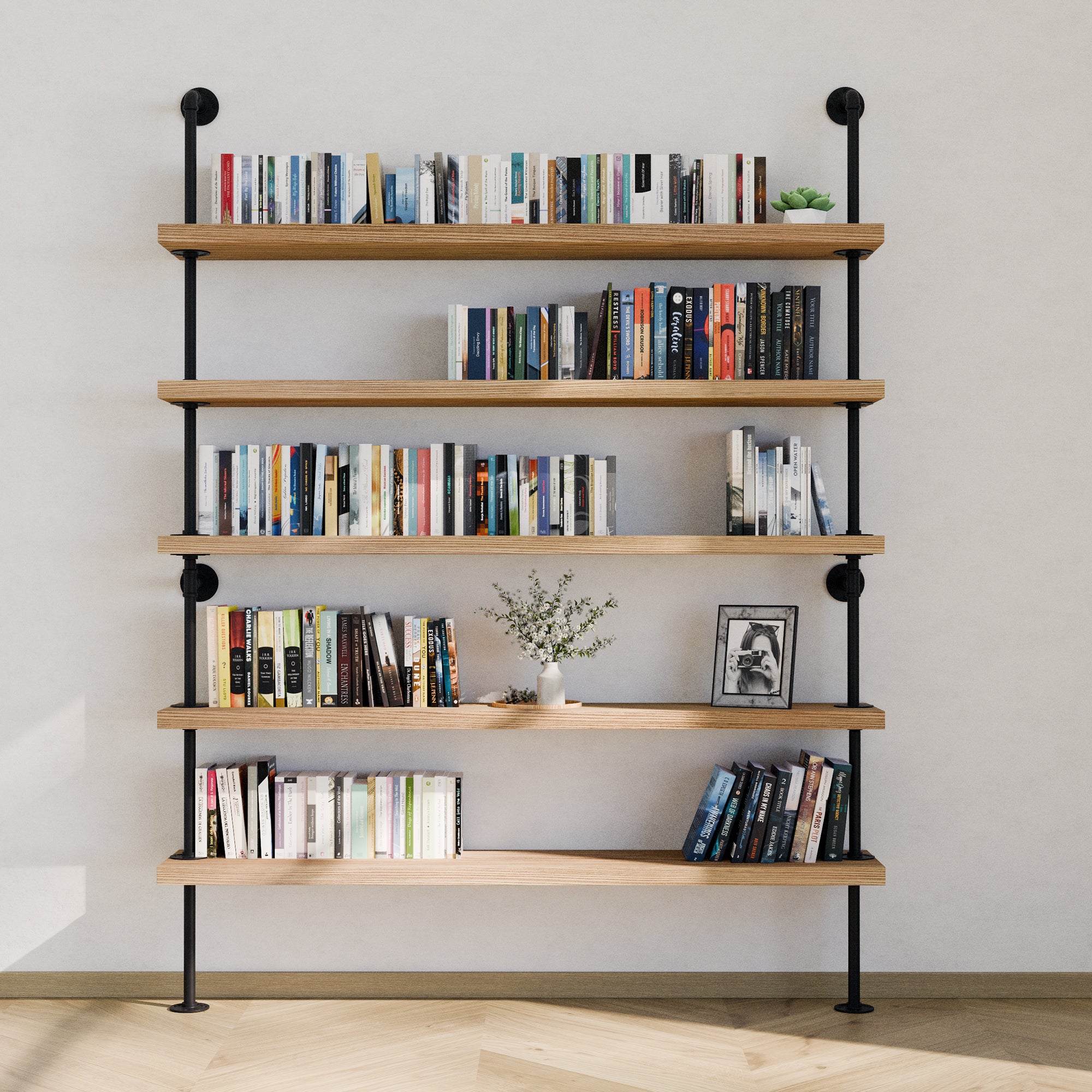 5 tier industrial bookshelf with books and decorative items against a white wall