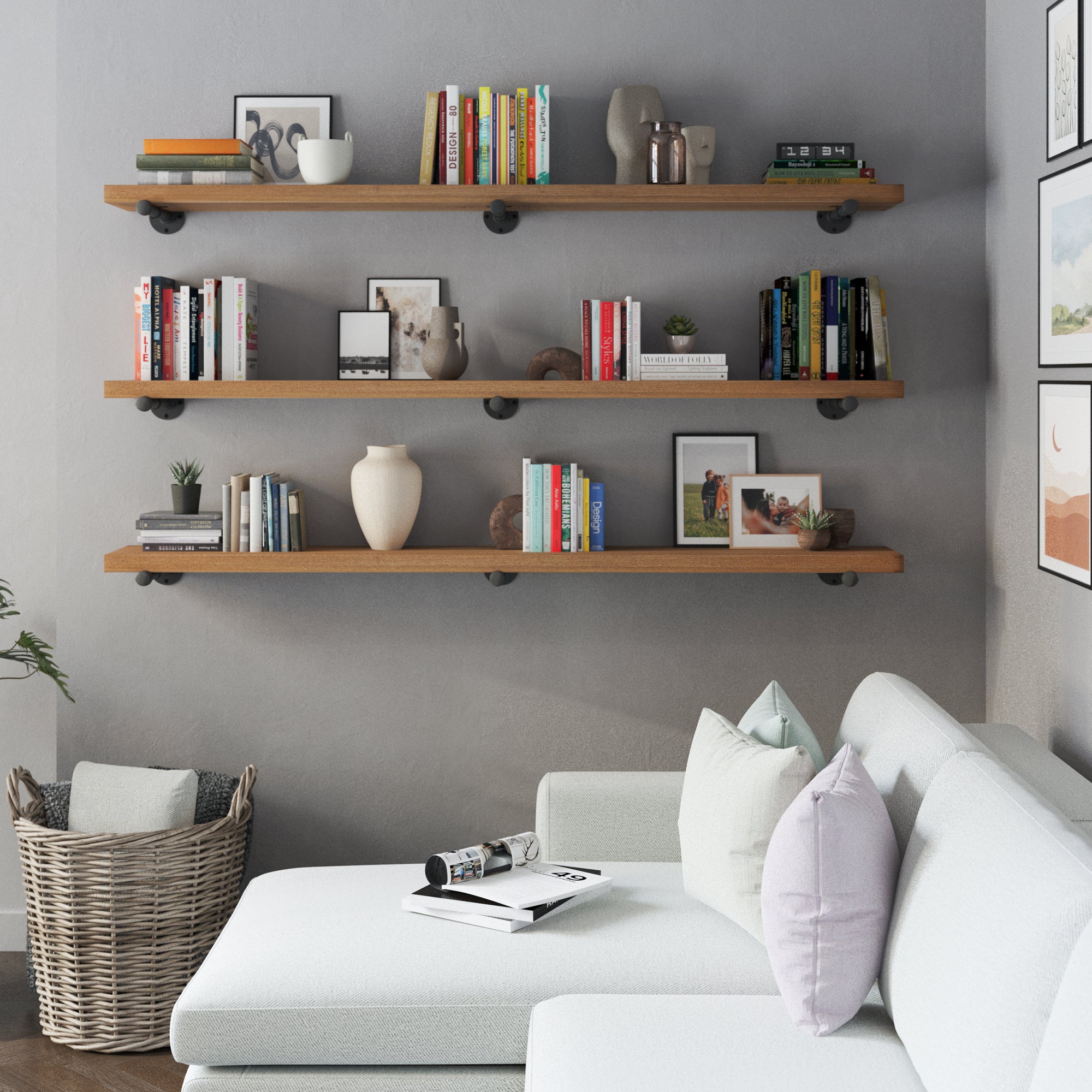 Three pieces of 72 inch long wall bookshelves with black pipe brackets in a Special Walnut finish. These extra long shelves maximize wall storage for books, plants, decorative pieces, and rustic-modern organization in living spaces.