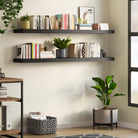 Modern home office with black office shelves offering a neat storage solution for books and decorative items, enriching the workspace.