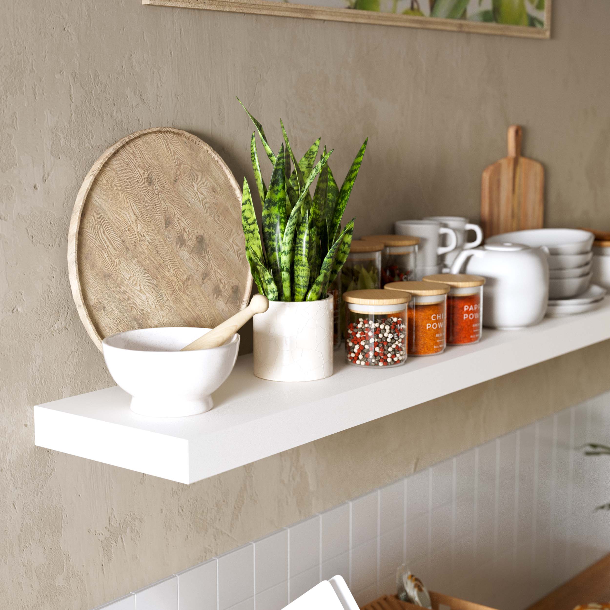 A kitchen space with a white floating shelf, showcasing kitchenware and plants. The shelf blends with the modern kitchen, adding a functional and aesthetically pleasing element for storing essentials.